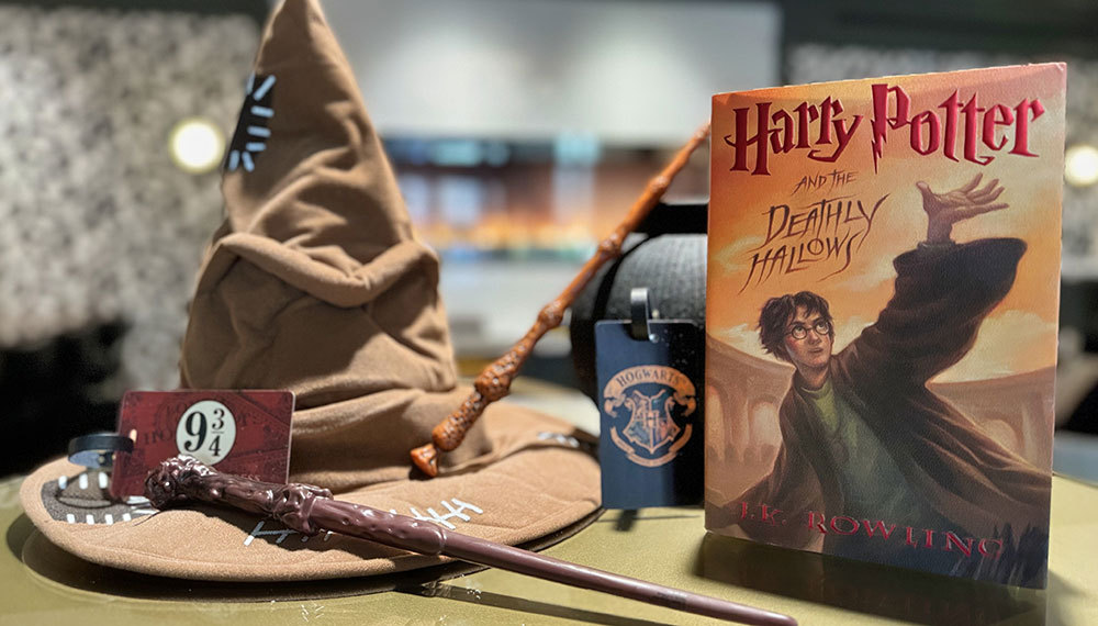 Harry Potter Sorting Hat, wand, luggage tag and book