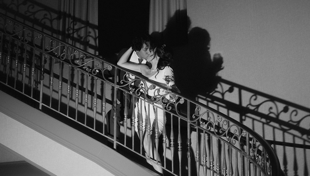 couple at marlowe hotel on the staircase